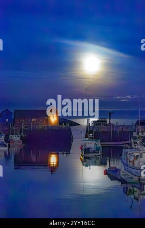 The Bright Cold Moon Illuminating the Sea at Bradley Wharf in Rockport, Massachusetts Stock Photo