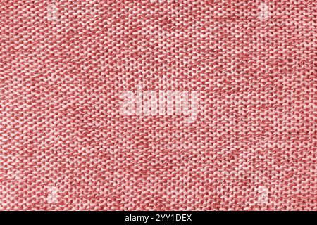 Mixed white and red color melange knitted fabric, cashmere wool cloth texture. Background of knit fabric, jersey textile structure, cloth surface, wea Stock Photo