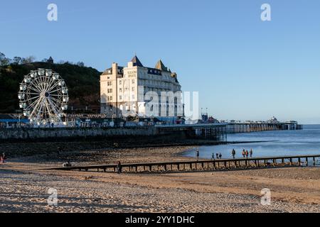 Big wheel and the Grand Hotel on Llandudno pier on the North Wales coast Stock Photo