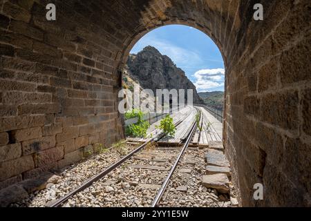 Train line and tunnel belonging to the current tunnel route between la Fregeneda and Barca D Alva. Stock Photo