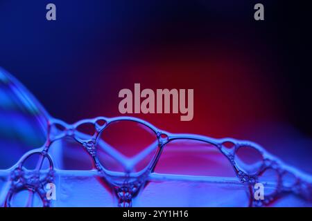 Blue fantastic reflections on black background, liquid abstraction, colour waves, deep dark backgrounds Stock Photo