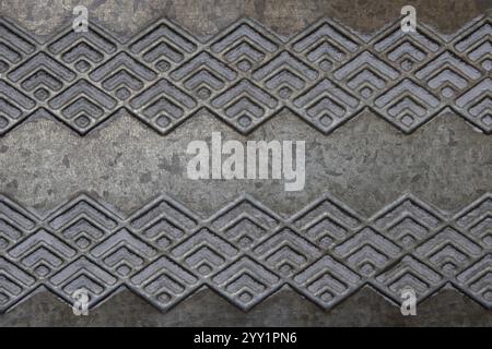 Metallic background in gray and angled patterns. Processed with stacked focus and Depth Compositing. Stock Photo