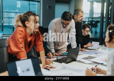 Diverse business team collaborating on a creative project together Stock Photo