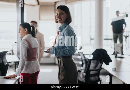 Multicultural team engaging in a collaborative office meeting Stock Photo