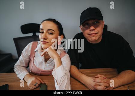 Young professionals collaborating on a project in a modern office setting Stock Photo