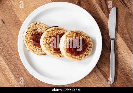 Classic british crumpets with jam on the plate Stock Photo
