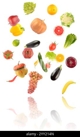Falling fruits and vegetables with light reflection isolated on white background. Stock Photo