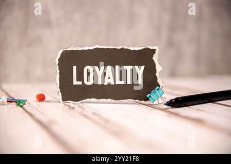 Loyalty Program text on a notepad on chart with keyboard and calculator. Stock Photo