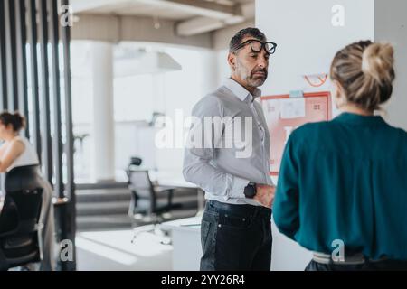 Professional interaction between colleagues in modern office setting Stock Photo