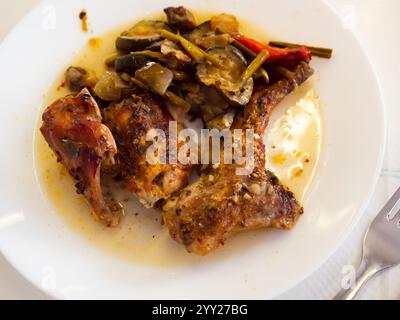 Roasted rabbit served with potato and vegetables Stock Photo
