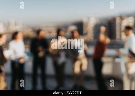 Multicultural business team celebrating with music and dance on rooftop Stock Photo