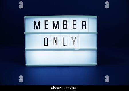 Member only letterboard text on LED Lightbox on blue background Stock Photo