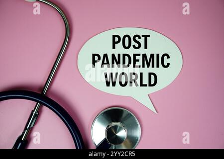Post Panedemic world text with stethoscope on pink background, Healthy and wellness concept Stock Photo