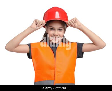 Girl with hardhat and vest pretending to be firefighter on white background. Dreaming of future profession Stock Photo