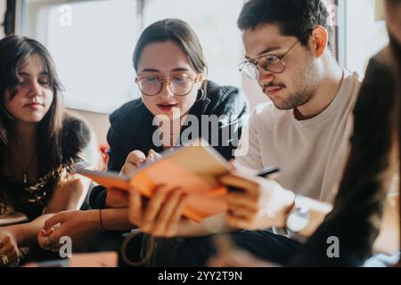 Students collaborating on school assignments in a casual setting Stock Photo