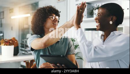 Programmer, meeting and tablet with manager, high five and work review for data analysis. Web designer, man and woman for celebration, website and Stock Photo