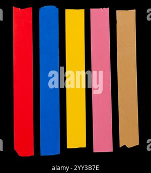 Top view set of multicolor adhesive vinyl or cloth tape in stripes is isolated on black background with clipping path. Stock Photo