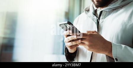 Business, man and hands with typing on smartphone for user research, email response and project feedback. Space, UX designer and phone for usability Stock Photo