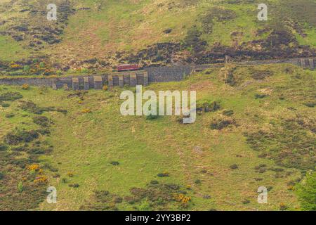 Near Agneash, Garff, Isle of Man - May 21, 2023: A Snaefell Mountain Tramway train traveling between Laxey and Snaefell Summit Stock Photo