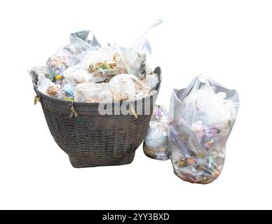 Garbage and offal pile in transparent white plastic bag at garbage dump is isolated on white background with clipping path. Stock Photo