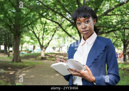 Woman taking notes Stock Photo