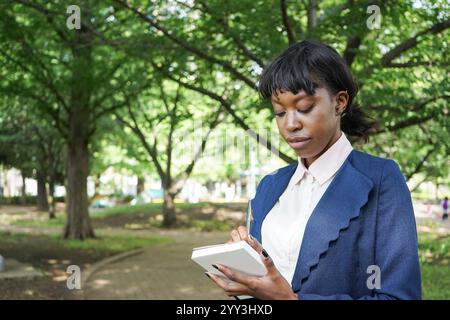 Woman taking notes Stock Photo
