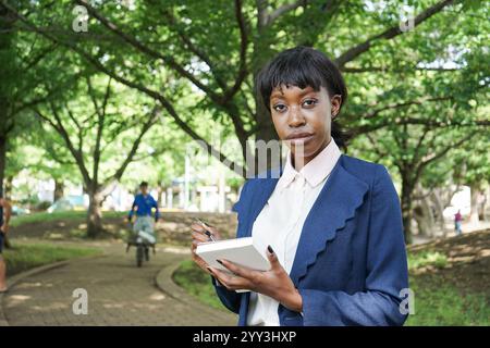 Woman taking notes Stock Photo