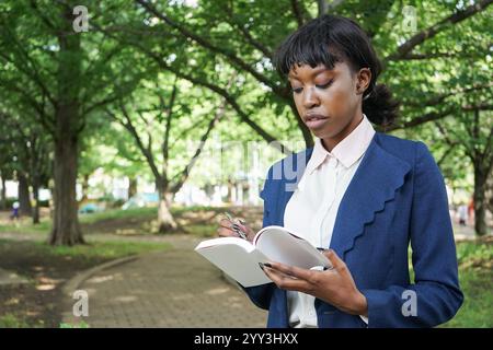 Woman taking notes Stock Photo