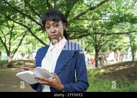 Woman taking notes Stock Photo