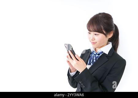 High school girl using a smartphone Stock Photo