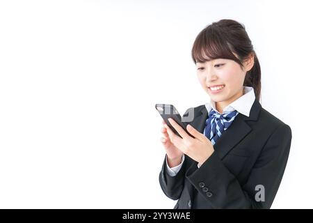 High school girl using a smartphone Stock Photo