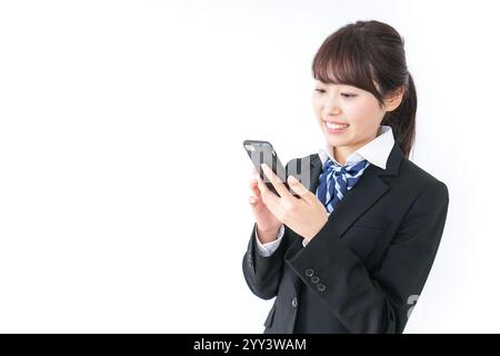High school girl using a smartphone Stock Photo