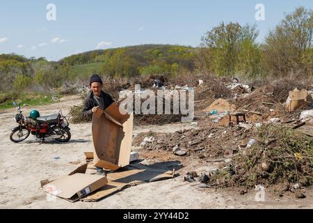 A view of the landfill. Garbage dump. A pile of plastic rubbish, food waste and other rubbish. Pollution concept. A sea of garbage starts to invade an Stock Photo