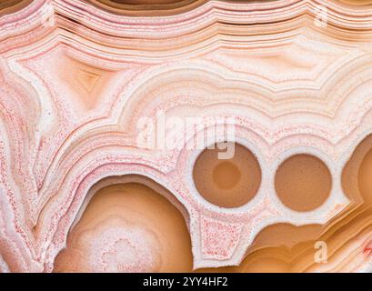 Close-up of the intricate structural patterns in a polished Laguna agate from Mexico, showcasing layered bands and natural colors, highlighting geolog Stock Photo