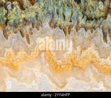 A stunning close-up of marble textures reveals intricate patterns with rich earthy colors. Ideal for backgrounds, designs, and showcasing the natural Stock Photo
