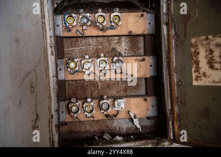 Old fuse box in an abandoned industry hall Stock Photo