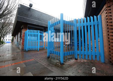 Hamburg, Germany. 19th Dec, 2024. View of the secured entrance area of a daycare center in the St. Georg district. So-called Nato wire has been rolled out over parts of the fence around the daycare center. The daycare center is located near Hansaplatz, which is considered a crime hotspot after part of the drug scene moved there from the main train station. Credit: Bodo Marks/dpa/Alamy Live News Stock Photo