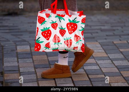 Strawberry Food carrier in Preston, Lancashire UK. 19 Dec 2024; UK Weather A sunny day for shoppers in the city centre.  Shop, Shop, Shop is the order of the day with 5 shopping days left till Christmas.  A continued reliance on high streets, even as online shopping dominates the festive season for buying Christmas gifts and presents Credit: MediaWorldImages/AlamyLiveNews Stock Photo