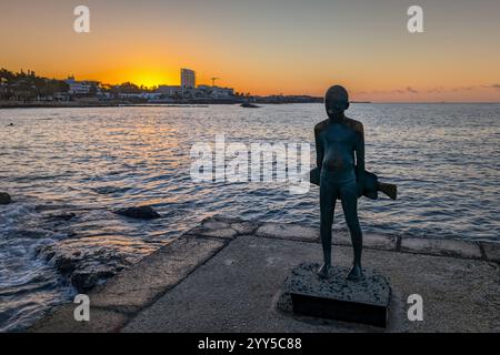 The Little Fisherman sculpture in Paphos Harbour area at sunrise, Cyprus Stock Photo