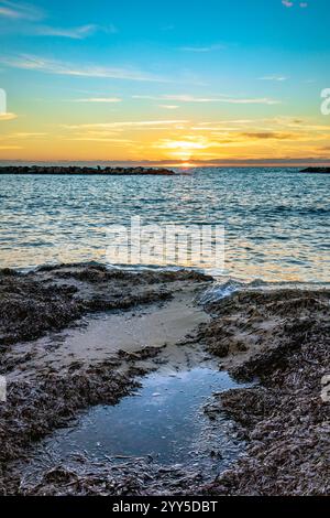 Sunset view from Venus Beach at Paphos, Cyprus Stock Photo