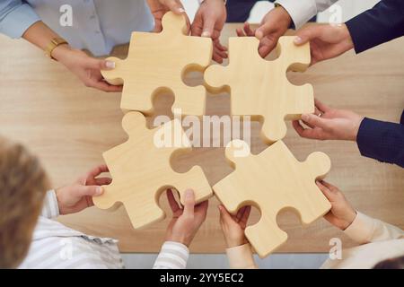Puzzle idea matching, business teamwork with puzzle of pieces showing cooperation unity partnership Stock Photo