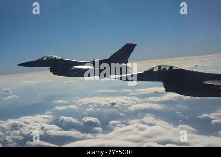 Two U.S. Air Force F-16 Fighting Falcons assigned to the 80th Fighter Squadron fly to join bilateral training with Republic of Korea Air Force fighter Stock Photo