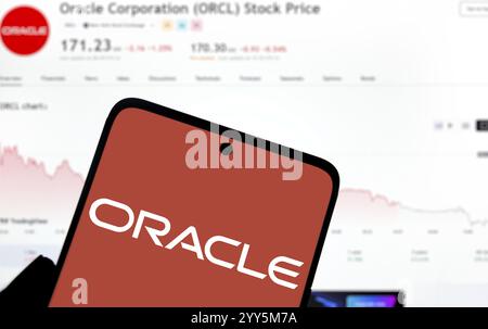 Oracle logo is diaplayed on smartphone. Oracle Corporation is an ...