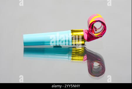 Party kazoo horn on colorful confetti stillife concept photo with text ...
