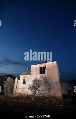 An old ruined building still standing with a night sky Stock Photo - Alamy