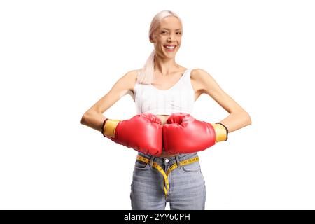Slim woman with boxing gloves smiling isolated on white background Stock Photo