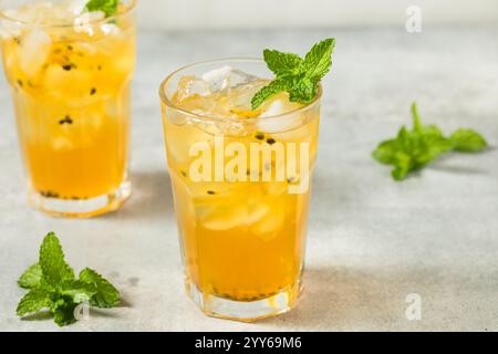 Cold Refreshing Passion Fruit Iced Tea with Mint Stock Photo