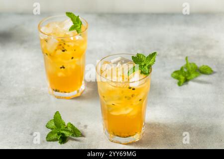 Cold Refreshing Passion Fruit Iced Tea with Mint Stock Photo