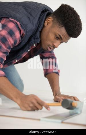 flooring hammer and tape measure Stock Photo
