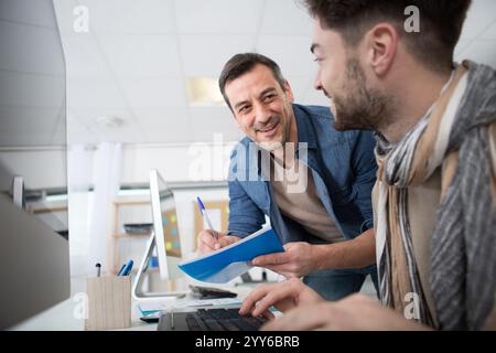 two happy architects working on the project Stock Photo